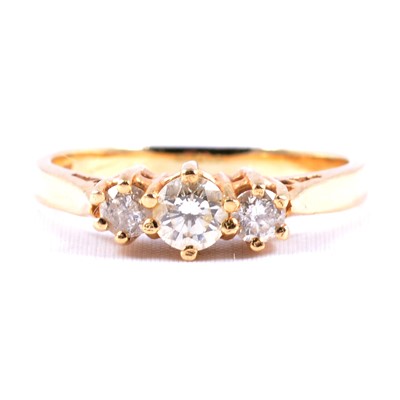 Lot 69 - A diamond three stone ring.