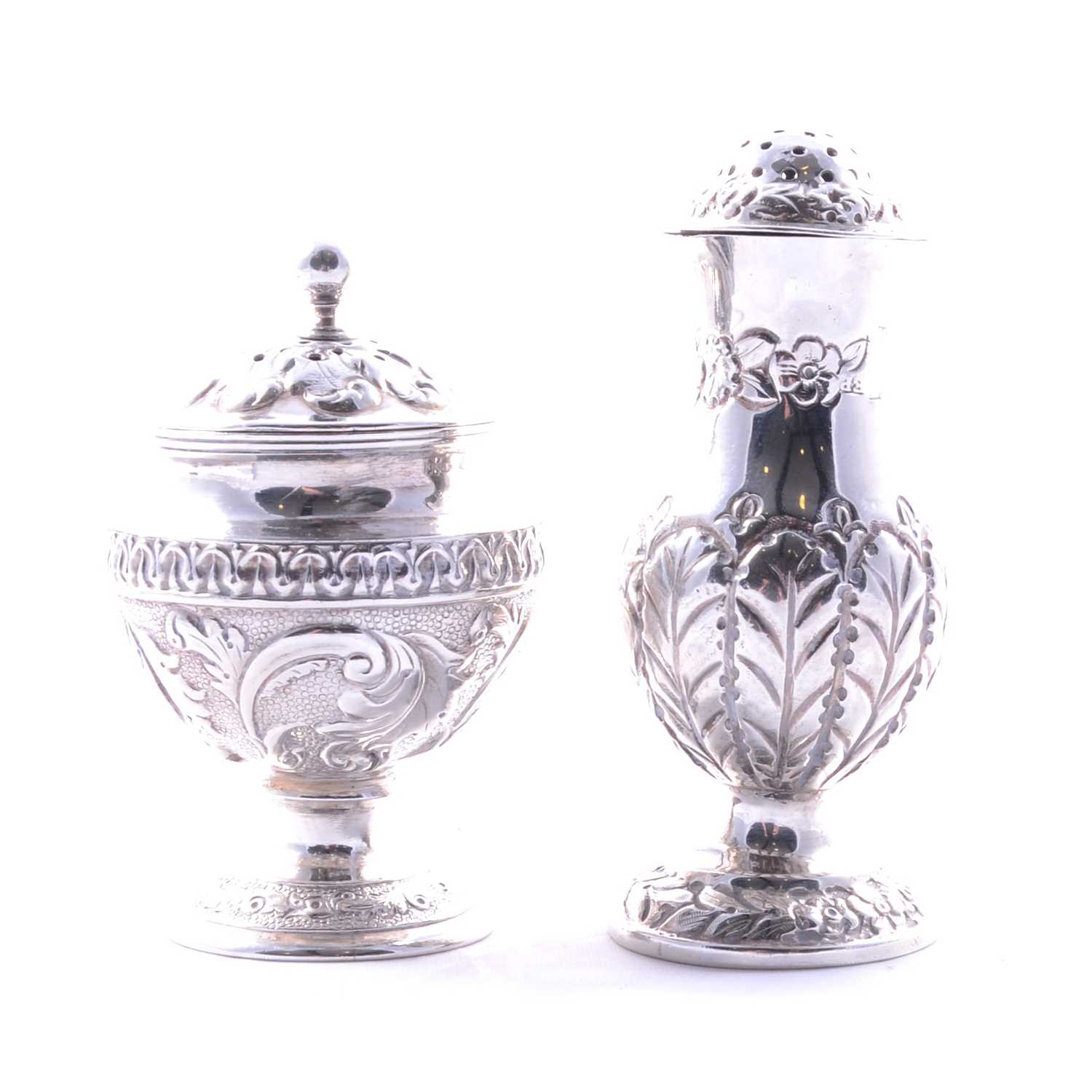 Silver Belette Lot 83 - Two silver pepperettes,