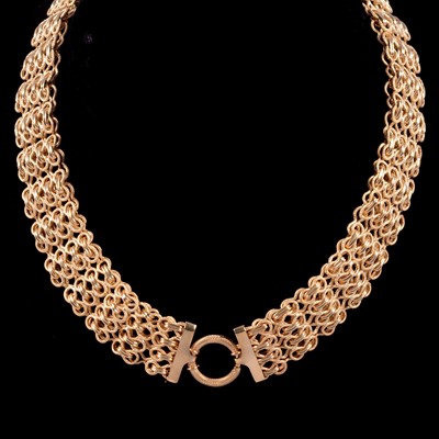 Lot 216 - A modern 9 carat yellow gold flexible linked collar necklace.