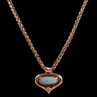 Lot 201 - A modern opal and diamond pendant and chain.