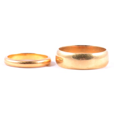 Lot 104 - Two gold wedding bands, 22 carat and 18 carat.