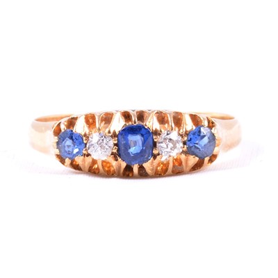 Lot 47 - A sapphire and diamond five stone ring.