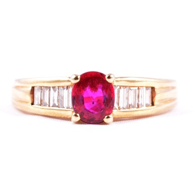 Lot 39 - A ruby ring with baguette diamond shoulders.