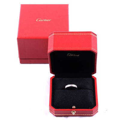 Lot 297 - Cartier - an 18 carat white gold Love ring.