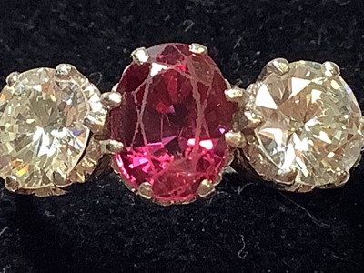 Lot 36 - A ruby and diamond three stone ring.