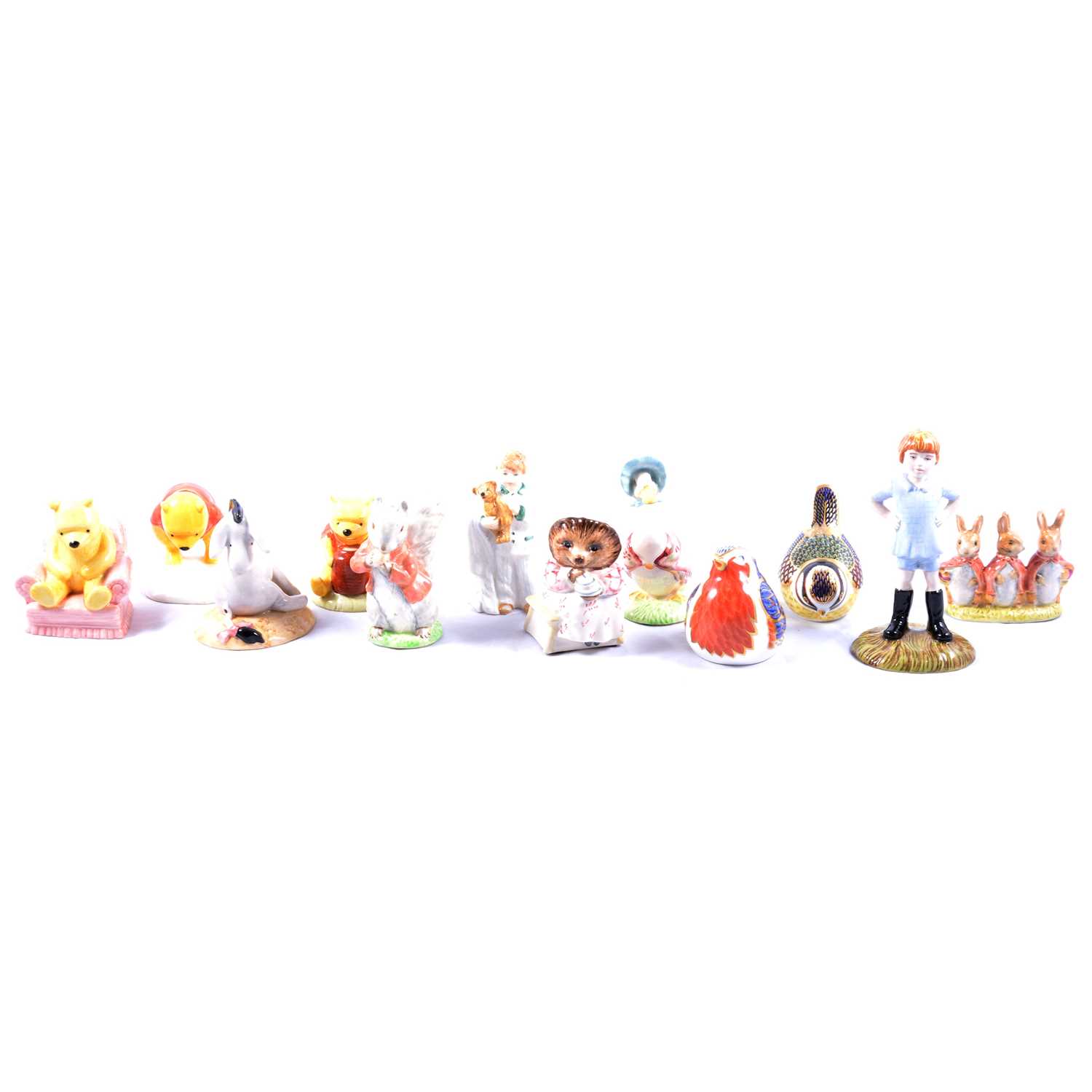 Lot 47 - Twelve Royal Doulton, Beswick and Royal Crown Derby figurines and paperweights.
