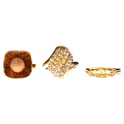 Lot 92 - Two gemset rings and a dish-shaped ring.