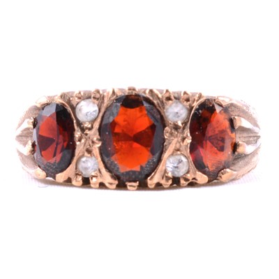 Lot 37 - A garnet and synthetic white stone ring.