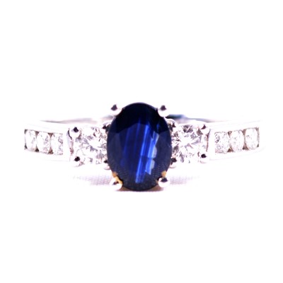 Lot 50 - A sapphire and diamond ring.