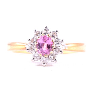 Lot 18 - A pink stone and diamond cluster ring.