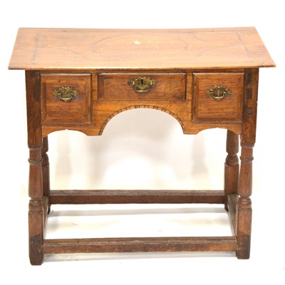 Lot 561 - George III oak lowboy