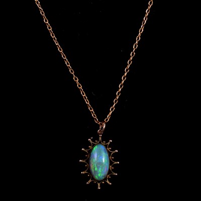 Lot 278 - An Edwardian opal pendant on a yellow metal chain.