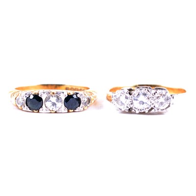 Lot 55 - A diamond three stone ring and a sapphire and diamond ring.