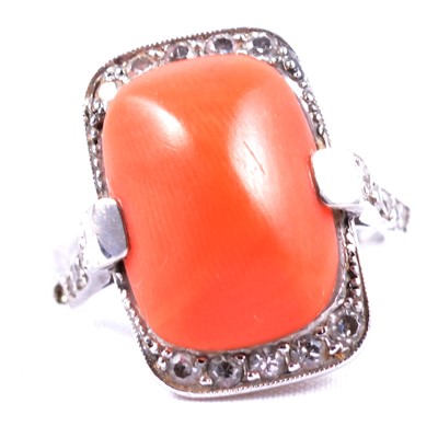 Lot 14 - A coral and diamond dress ring.