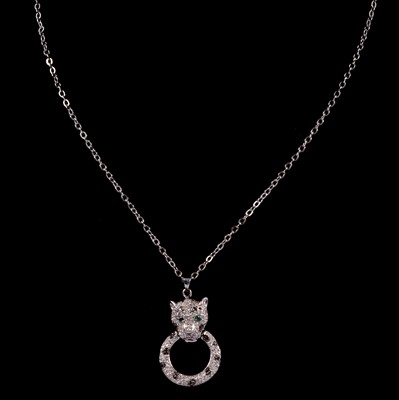 Lot 303 - Effy - a diamond and emerald set panther head pendant and chain.