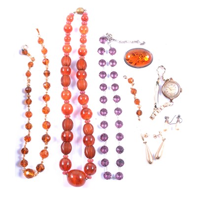 Lot 296 - An amber brooch, two bead necklaces, mauve paste necklace, two pairs of earrings, Le Roy watch