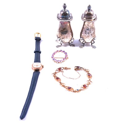 Lot 473 - An amethyst and diamond brooch, garnet and pearl bracelet, gold wristwatch and silver condiments.