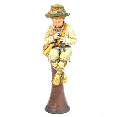 Lot 361 - Bretby pottery figure of a seated Neapolitan boy playing a flute, on an Art Nouveau pottery stand