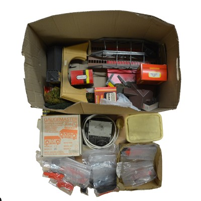 Lot 116 - A box of Hornby OO gauge trackside buildings and accessories, with control units.