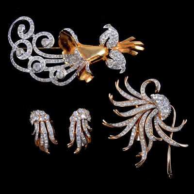 Lot 451 - Trifari - a paste set brooch and matching pair of earclips and a similar brooch.