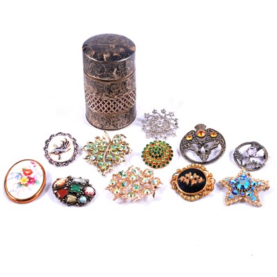 Lot 475 - A collection of costume jewellery brooches and cologne bottle in silver cover.