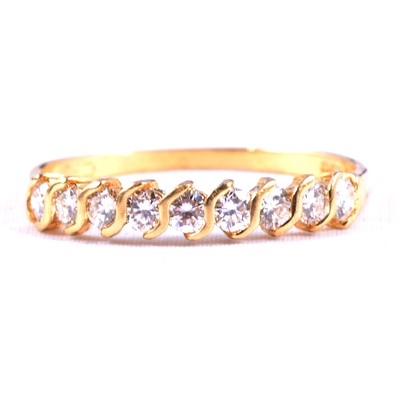 Lot 77 - A diamond half eternity ring.