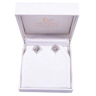 Lot 152 - A pair of diamond set earrings.