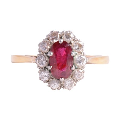 Lot 10 - A ruby and diamond cluster ring.