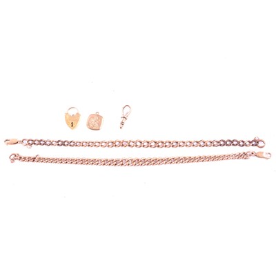 Lot 265 - Two 9 carat rose gold curb links bracelets and padlock and charms