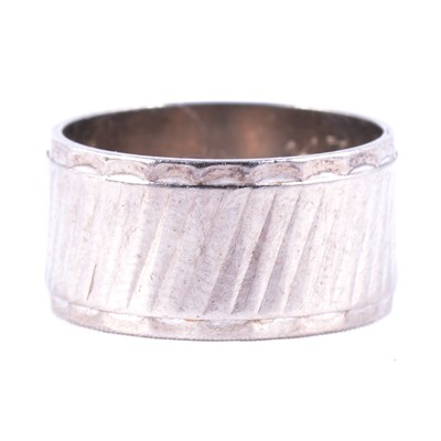 Lot 114 - An 18 carat white gold wedding band.