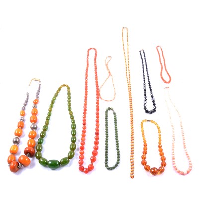 Lot 294 - Eleven natural stone and other bead necklaces.