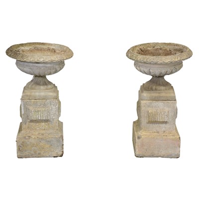 Lot 534 - Pair of modern composition stone campana urns on plinths