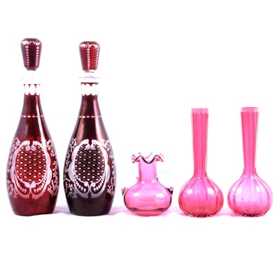 Lot 42 - Pair of Bohemian ruby glass decanters, pair of cranberry glass ribbed bottle vases and a ruby glass vase