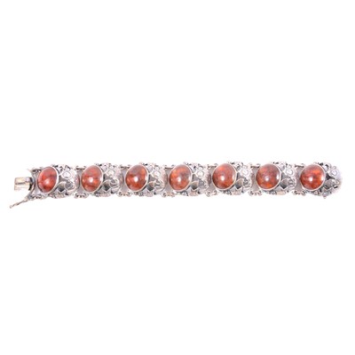 Lot 417 - N E From of Denmark - an amber and silver fish panel bracelet.