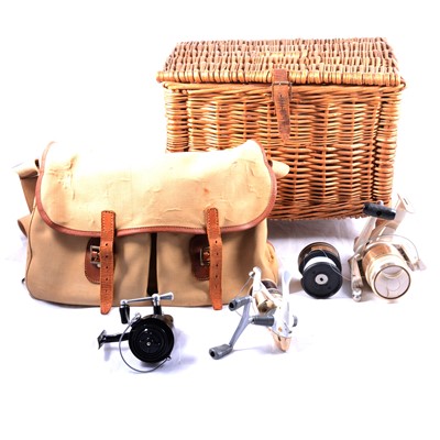 Lot 202 - Quantity of fishing equipment including spinning reels, wicker seat, and Hardy canvas bag