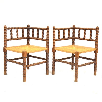 Lot 336 - Pair of bobbin turned corner chairs with rush seats.