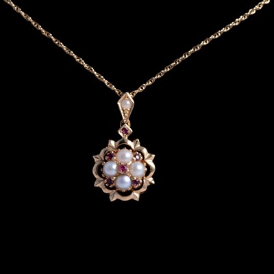 Lot 276 - A garnet and pearl pendant on a chain.