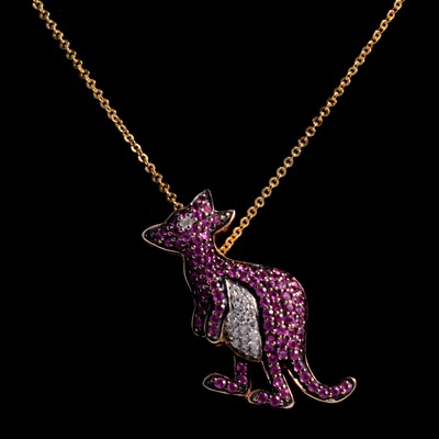 Lot 270 - A ruby and diamond kangaroo pendant on chain.