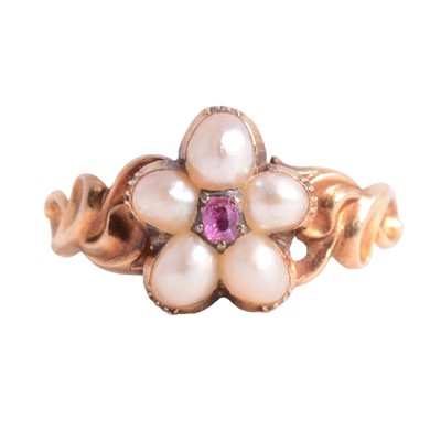 Lot 19 - A Victorian ruby and pearl floral design ring.