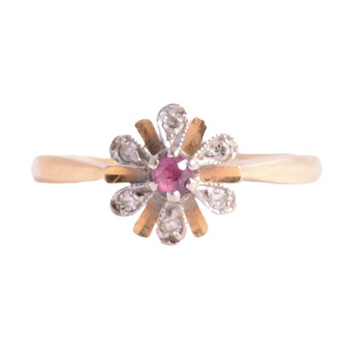 Lot 16 - A ruby and diamond floral ring.