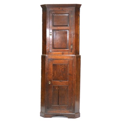 Lot 321 - George III oak freestanding corner cupboard