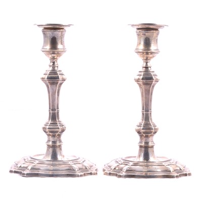 Lot 399 - Pair of Edwardian silver table candlesticks, William Hutton & Sons Ltd, London 1905.