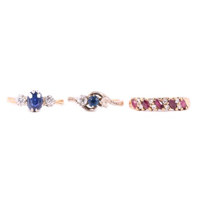 Lot 18 - Three gemset rings, ruby and diamond, sapphire and diamond, synthetic sapphire and white zircon.