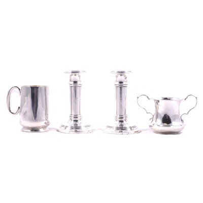 Lot 390 - A pair of silver candlesticks, christening mug, twin handled pot.