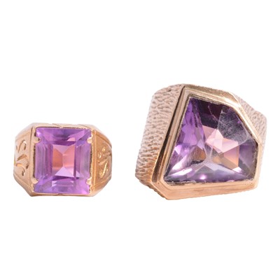 Lot 28 - A large amethyst dress ring and another with synthetic pink stone.