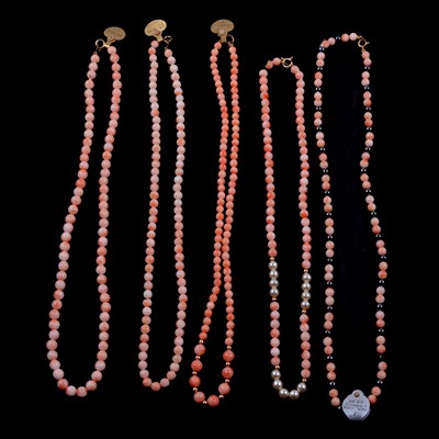 Lot 328 - Ten coral and pink conch shell necklaces.