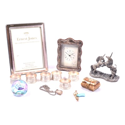 Lot 412 - Six silver napkin rings, Tissot watch, silver locket and chain, two photograph frames.