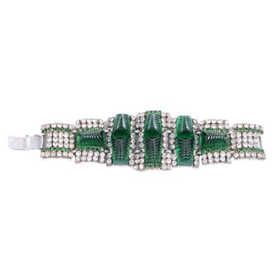 Lot 454 - A 1950's moulded green paste and clear paste bracelet.