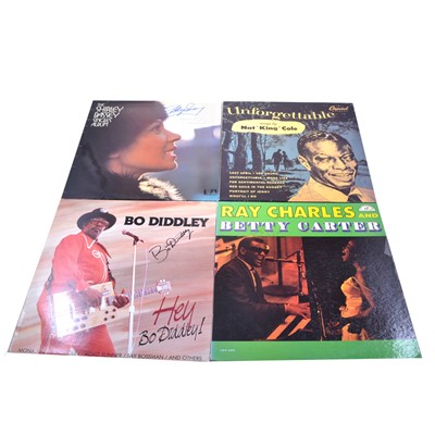 Lot 102 - Four signed 12" vinyl records - Bo Diddley, Shirley Bassey, Ray Charles, and Nat King Cole