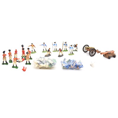 Lot 214 - Britains Toys plastic figures and spare parts, including two loose military guns ref 9737 and 9736.